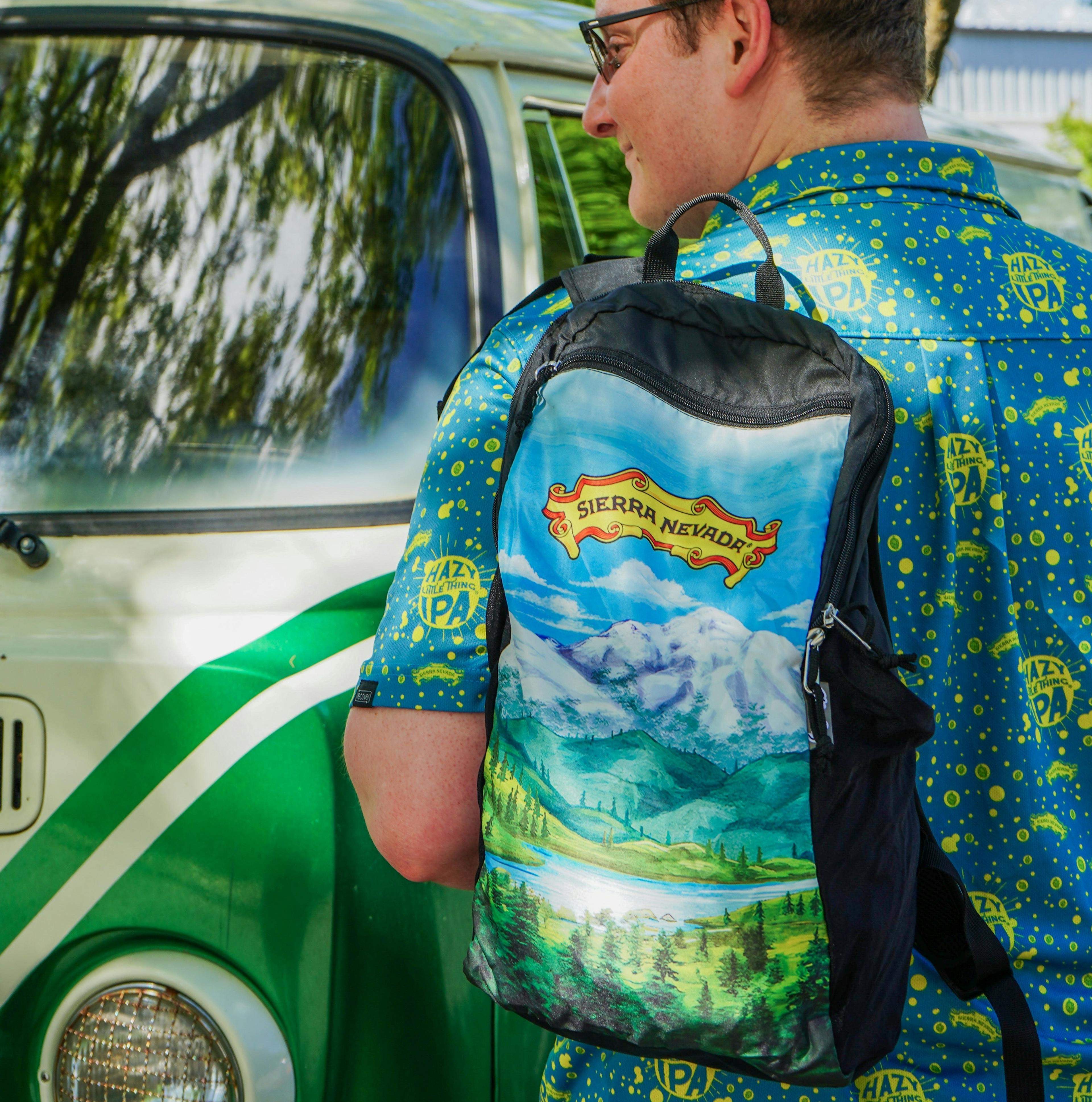 A man wears the Sierra Nevada X ChicoBag travel pack across his shoulder