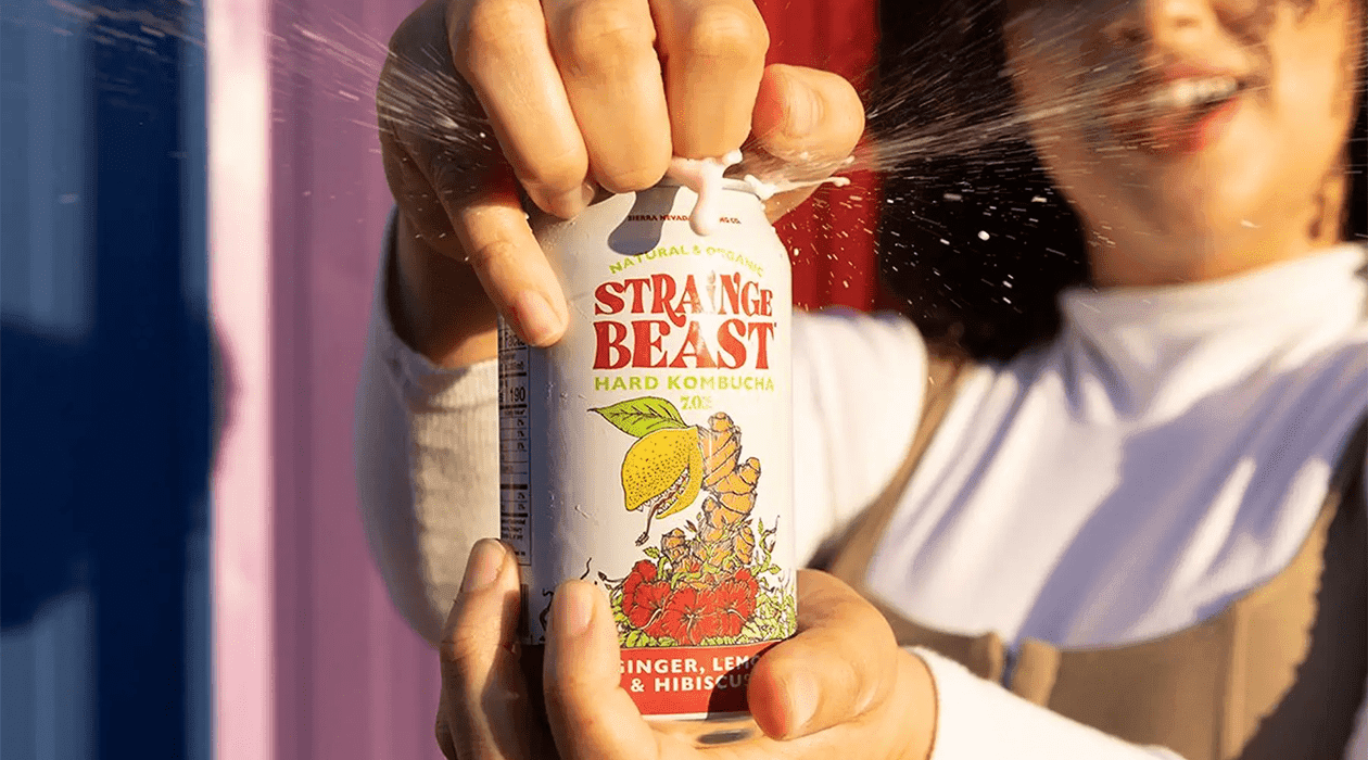 Strainge Beast Hard Kombucha can being opened